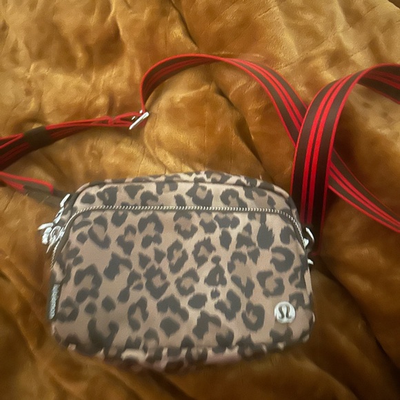 lululemon athletica Handbags - lululemon athletica Leopard Print Crossbody with Red Striped Strap